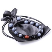 Pearl-armband knutna i l�der.